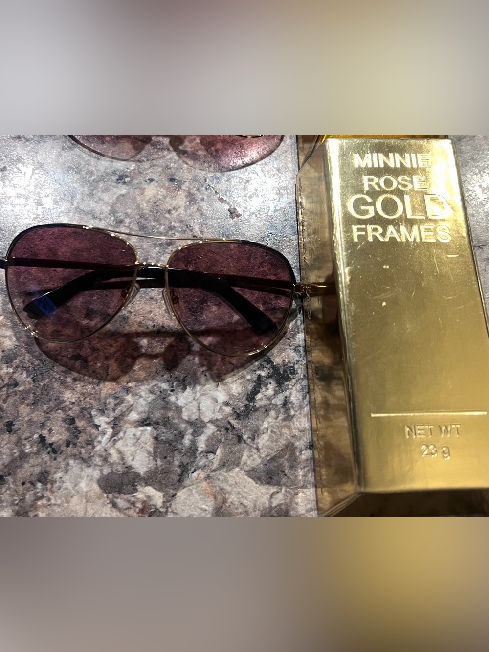 Minnie Rose Gold Frame Sunglasses with black trimming.